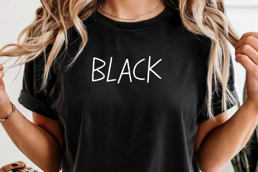 a woman wearing a black shirt with the word black on it
